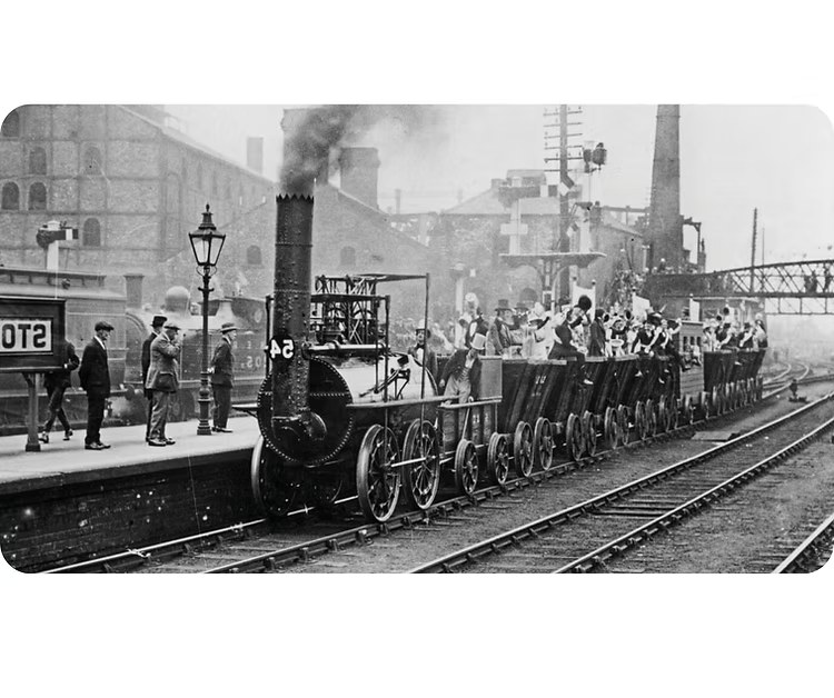 Historic train at a railway station platform, reflecting Le Feast's rail station roots